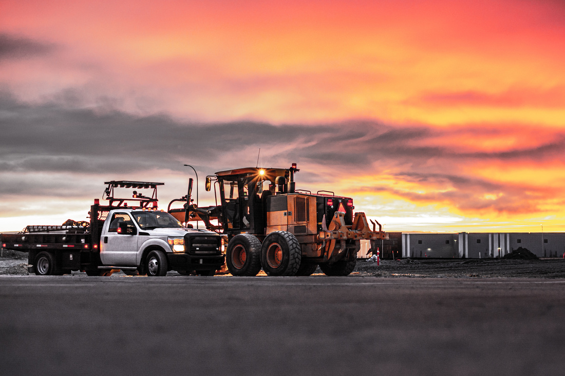 Service bodies on white truck at sunset on work site