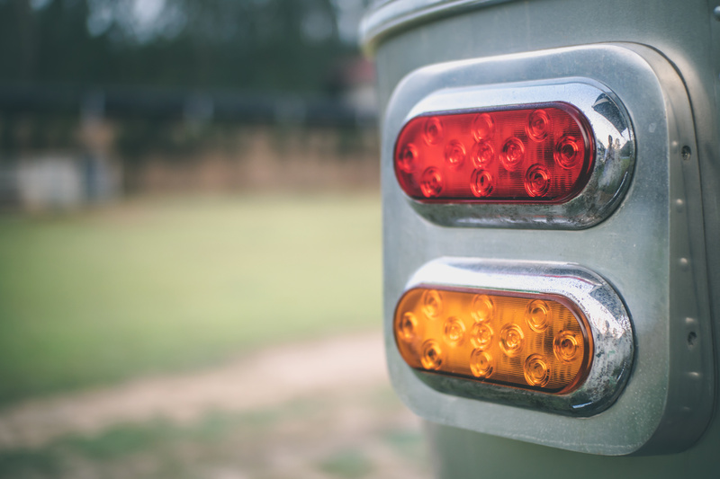 Close up red and yellow classic taillight of travel trailer.