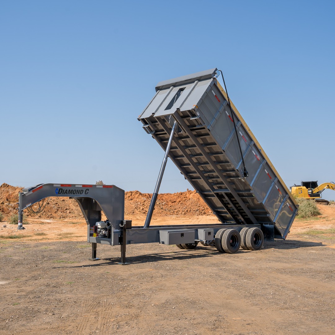 Diamond C Dump Gray Diamond C dump trailer in use.