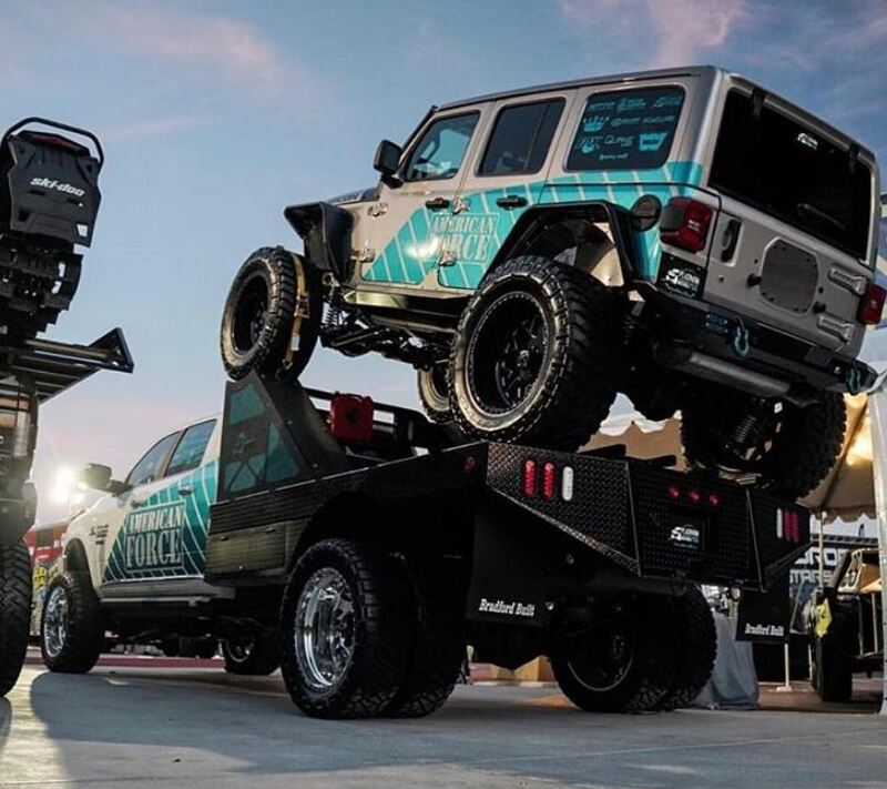 Branded steel workbed with a vehicle in it. 