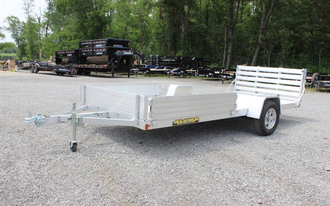 An Aluma Trailers utility trailer on the Country Blacksmith dealership lot.