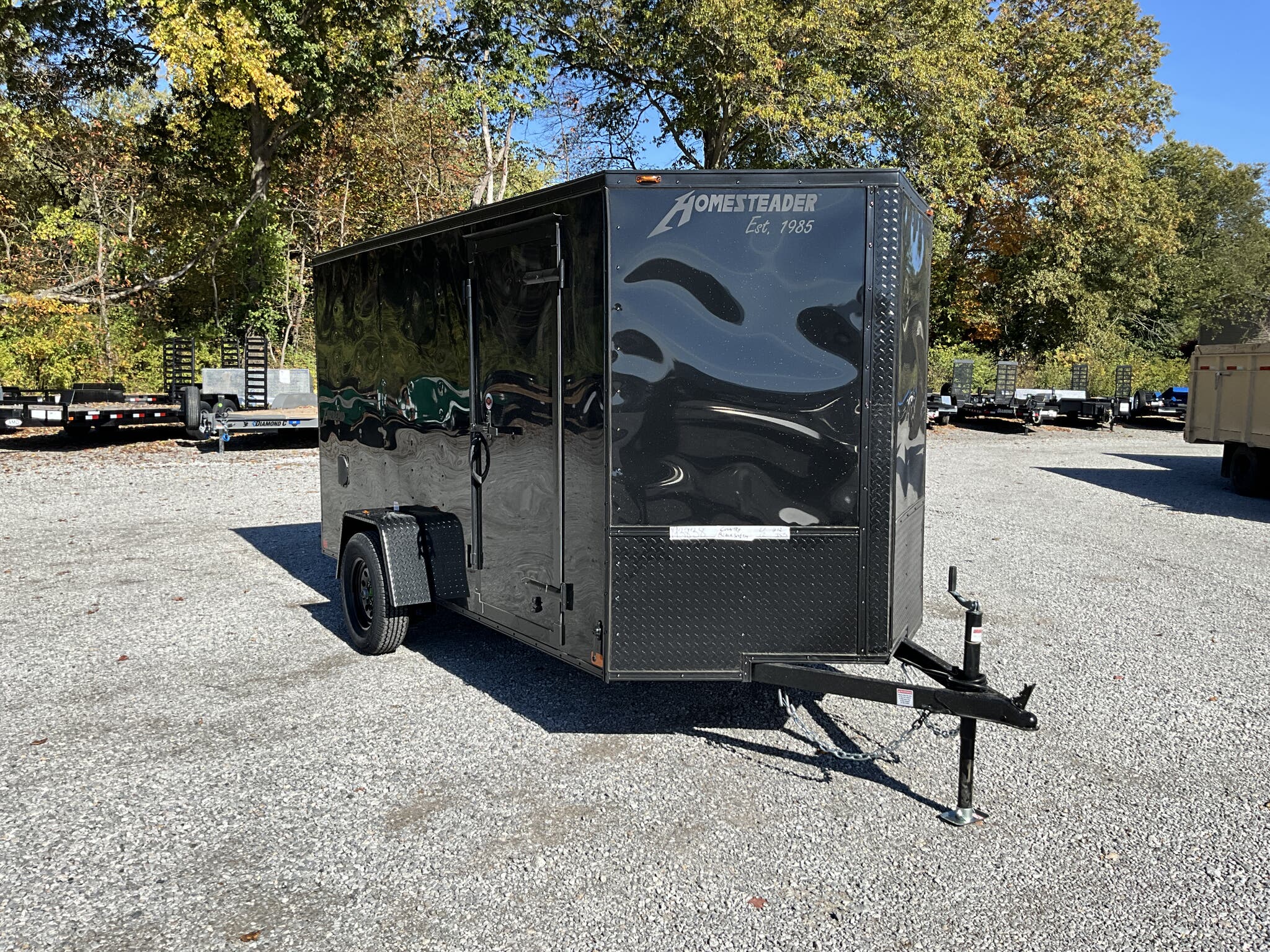 A blackout 6x12 enclosed cargo trailer from Homesteader. 