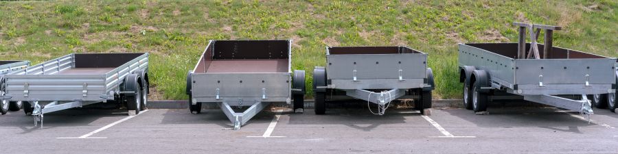Four trailers parked on a lot